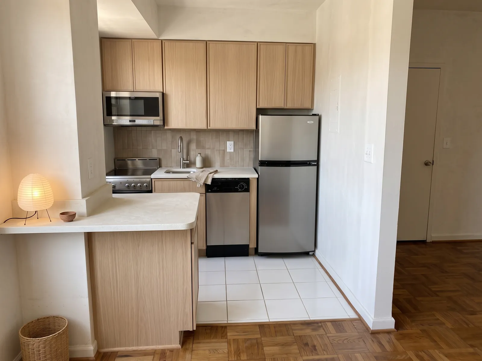 Rejected AI generated Japandi render of the same kitchen: pale oak cabinets and a paper lamp, but the whole view has shifted up and to the side, so a doorway that was out of shot now appears on the right.